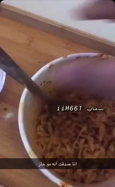 Eating spicy noodles