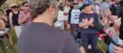 Antimasker calls for civil war whilst holding a sign with the home adresses of LA city council members.