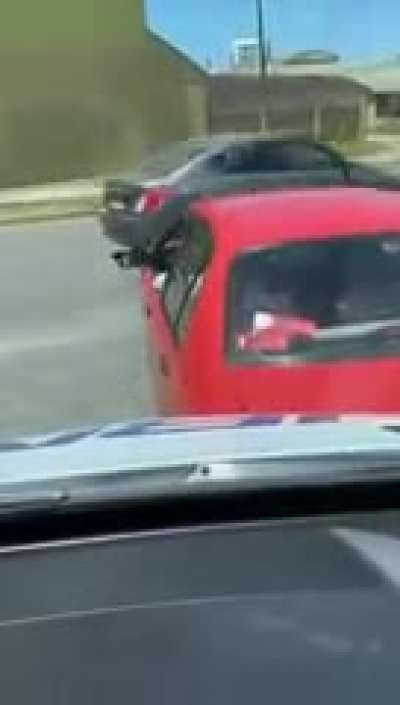 Car blocks ambulance with sirens on