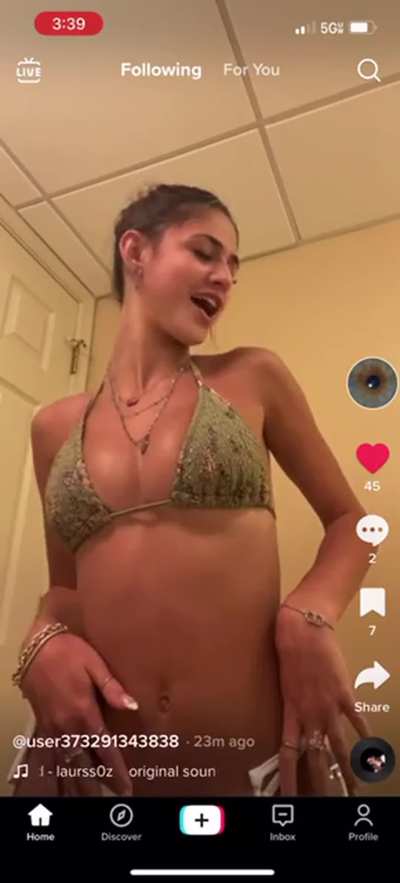 Shea showing her tanlines