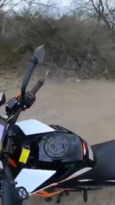 A crazy guy threatens to stab biker.