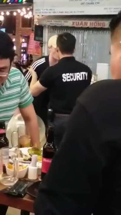 Guy keeps getting in bouncer's face, gets elbowed