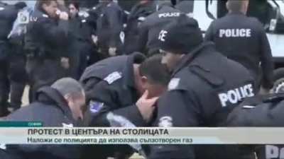 Bulgarian police uses pepper spray on protesters, and the wind blows it back into their faces.
