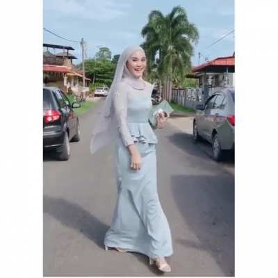 Pretty hijabi in a modern traditional dress.