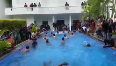 Sri Lankan protestors having a swim in the president’s house