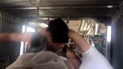 Things escalate as Man and “Demon” argue on the train..