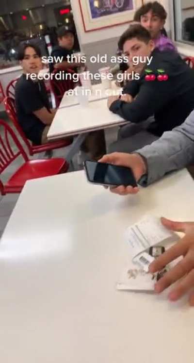 Man confronting old guy taking video of the girls sitting next to him at in n out.