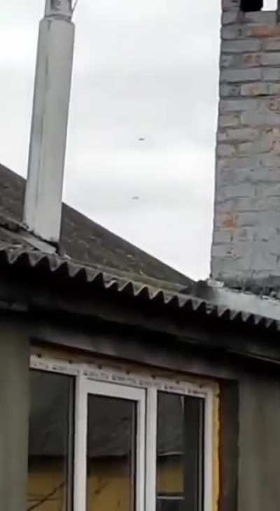 Two Russian pilots parachute down after their plane was shot