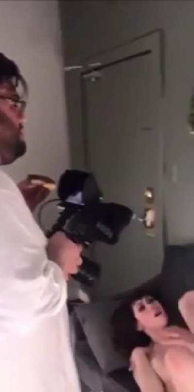 Porno Cameraman snacking on the job…