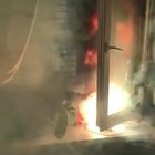 Woman launches a firework from inside her apartment