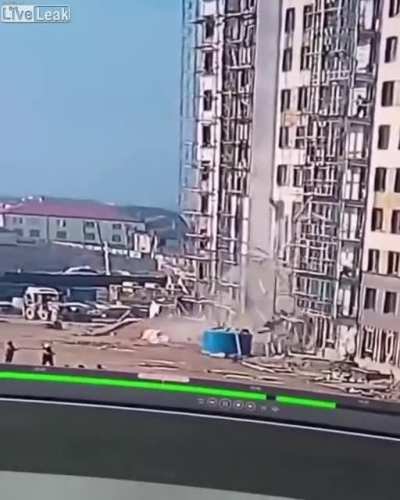 Scaffolding collapses beneath a worker in Dagestan