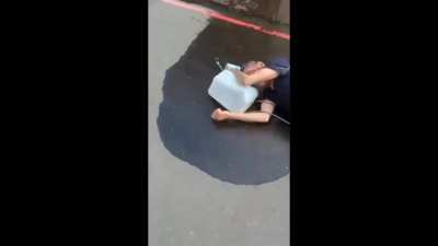 Psycho with a spray gun full of gasoline and blowtorch tries to set father and son on fire and gets KO'ed