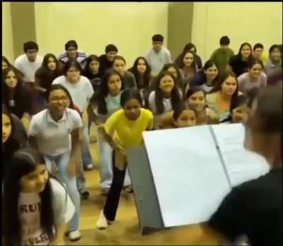 (Please Close your eyes the first time you watch this) These children are creating the sound of rain.