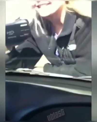 Sitting on the hood of a moving vehicle