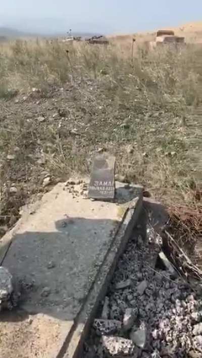 An Azerbaijani soldier visits the destroyed grave of his father in Zengilan / Karabakh, which was liberated by the Azerbaijani army. The Armenians destroyed everything non Armenian in region. Even the graves.
