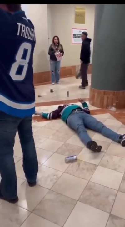 Old guy gets knocked out at a hockey game by dollar store Jacob Trouba
