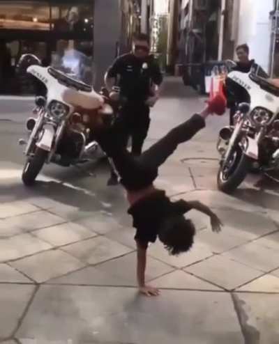 Hip hop battle between kid and cop