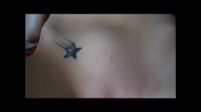 He's trying to poke her belly button