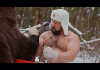 Russian guys armwrestle a bear