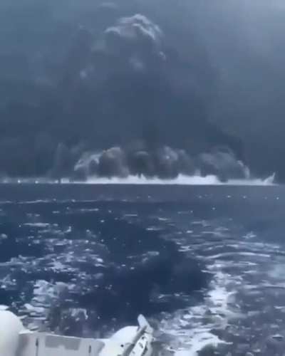 Sailboat attempting to out run a volcanic eruption in Stromboli Italy.