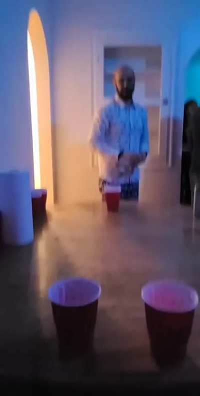 A rousing game of beer pong with a stranger