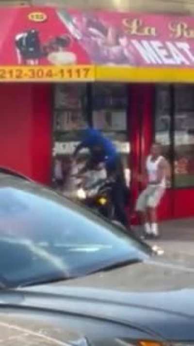New York City bystander beats up an armed robber and steals his gun