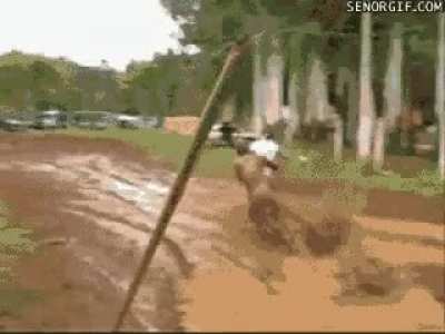 Woman walks across a mud lake