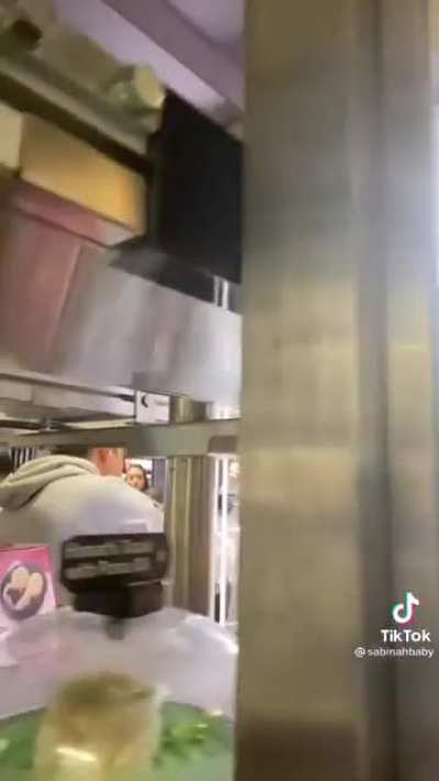 Putting a phone on a sushi conveyer belt in NY
