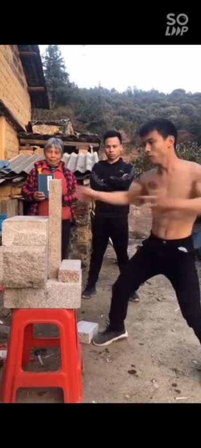 A guy (if anyone knows his name please inform us) breaks a block with his hand. He is so fast I had to put slow motion effect to see if it was real, wait till the end to see the slo-mo.