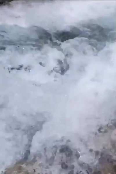 Guy falls from waterfall.