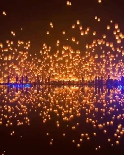 Thousands of lanterns launched into the night sky