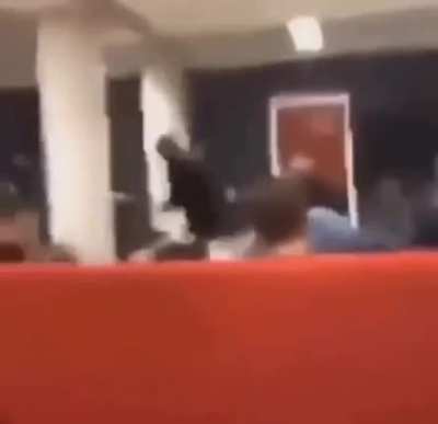 Pouring water on a strangers head