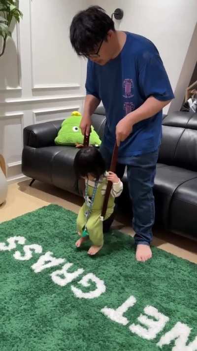 Taking off his belt.