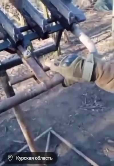 A North Korean Soldier shows a contraption he uses to take down Ukrainian Drones