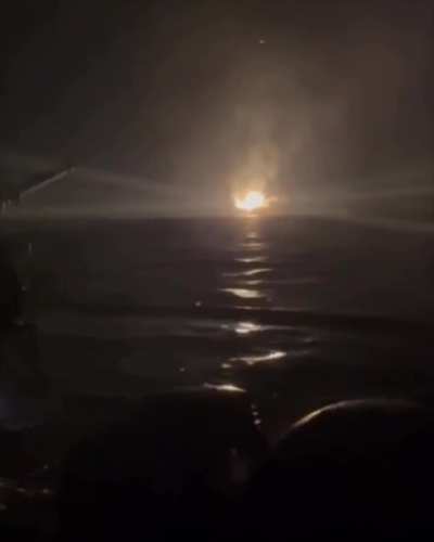 The burning Black Sea Crimea-2 platform as seen by an HUR member in an assault boat. The raid took place on the night of September 11, 2024.
