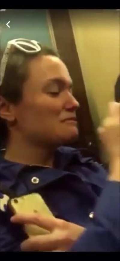 Guys share blunt on NYC subway
