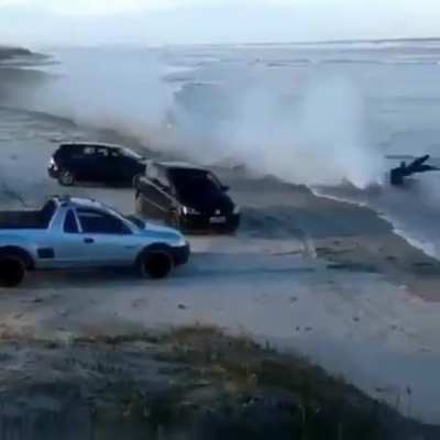 Riding a motorcycle through an approaching tide