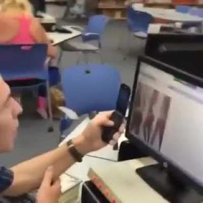 Using the public library to add a few more pictures to his spank bank collection on his 30MB storage phone.