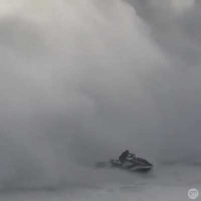 Jet ski driver saves a guy from a big wave