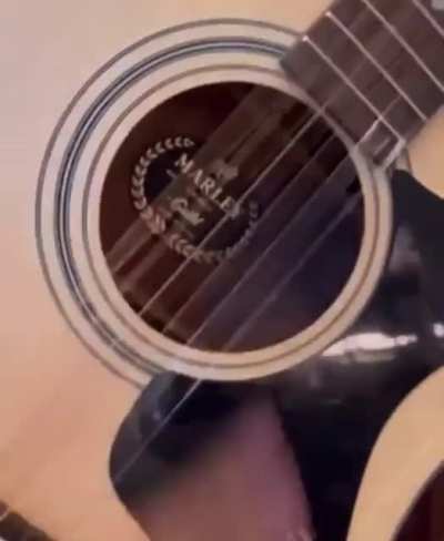 DJ Khaled playing the Guild A-20 Marley guitar