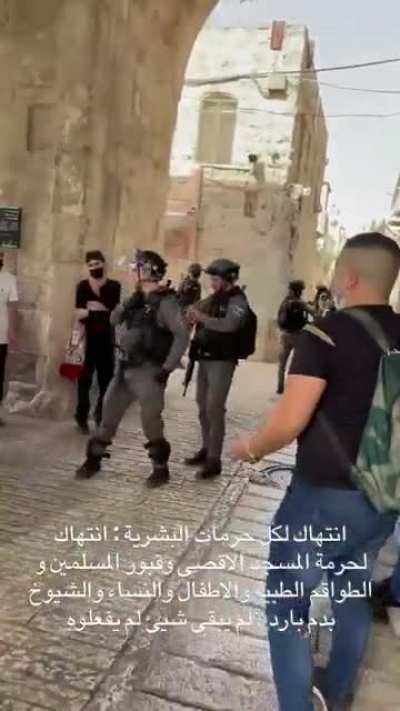 IOF Soldier throwing a flashbang at medics and an ambulance in Jerusalem.