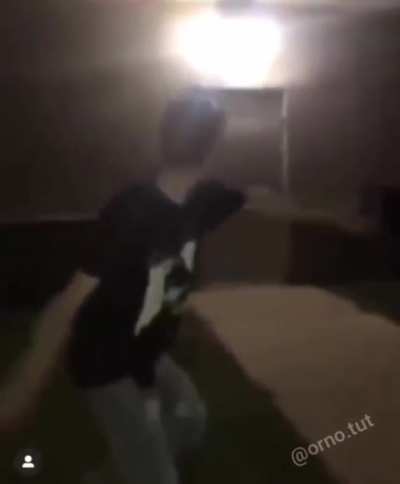 Throwing a bottle on the wall.