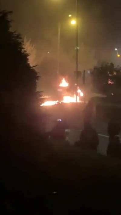 Violent rioter ignited by a misthrown petrol bomb in Belfast tonight