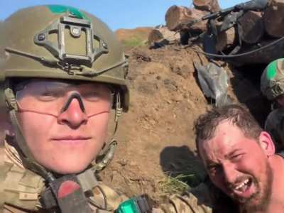 Roman Trokhymets from the AZOV battalion patch up a fellow soldier for evacuation. May 2023 somewhere around Bachmut | with subs