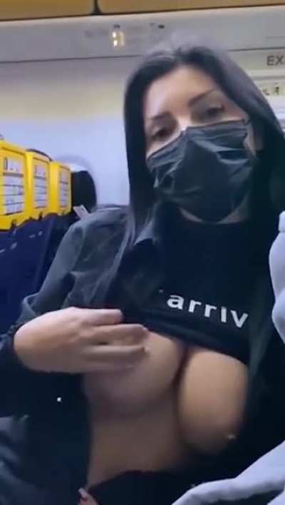 Flash boobs in airplane