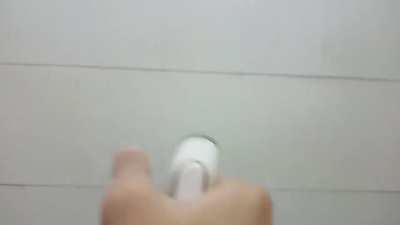 Guy plays mission impossible theme on shower hose