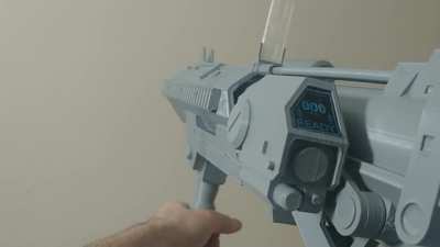 Kinda new to Reddit, but I 3d modeled and printed the Reach Grenade Launcher with a bit of functionality to it! It's unpainted, but it's fully assembled.
