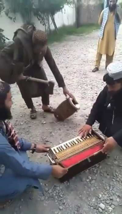 Taliban destroy musical instruments