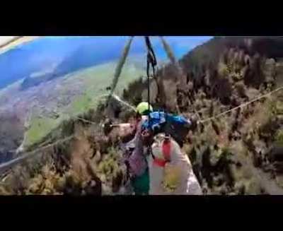 Hand glider pilot forgot to attach his passenger...