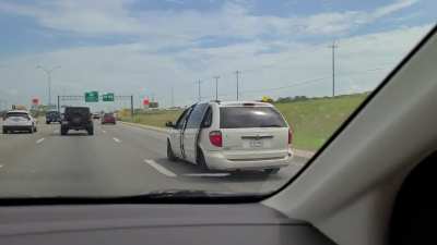 Passed this van in TX. Door open while texting and driving